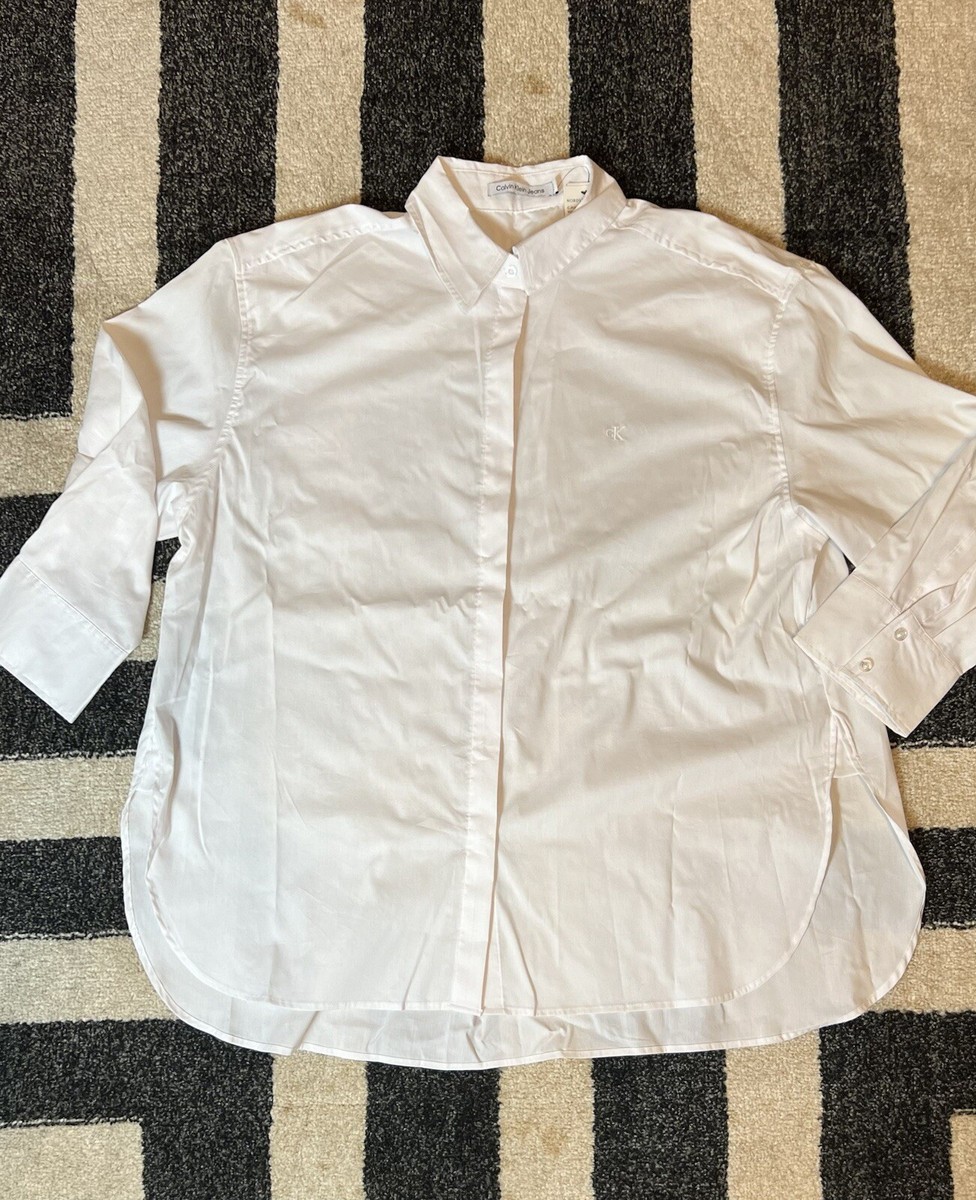 calvin klein white dress shirt womens Calvin Klein Jeans Long Sleeve Stretch Poplin Button-Up Shirt in White at Nordstrom Rack, Size X-Large