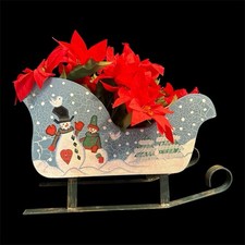 Blue Santa Sled With Metal Runners And Poinsettia Stems To Make Arrangement