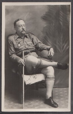 Marshall L Perrin Wellesley MA RPPC seated w/ walking stick ca 1920