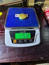 57 grams gold round 22k 3310.75 per troy oz