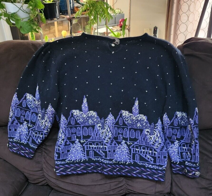 cullinane sweater made with cotton,lambswool,and angora. Has a winter town motif