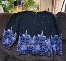 cullinane sweater made with cotton,lambswool,and angora. Has a winter town motif