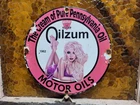 VINTAGE OILZUM PORCELAIN SIGN MOTOR OIL GAS STATION SERVICE PUMP PLATE GIRL 12"