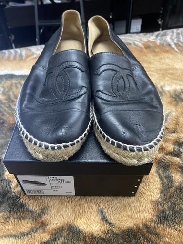 black chanel slip ons