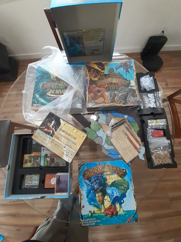 Spirit Island with 2 unopened expansions: Nature Incarnate & Jagged Earth.