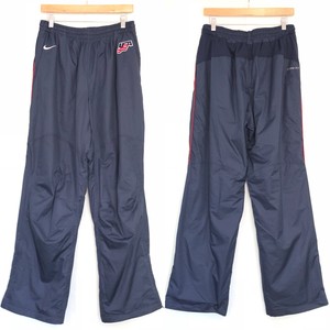 calça corta vento nike