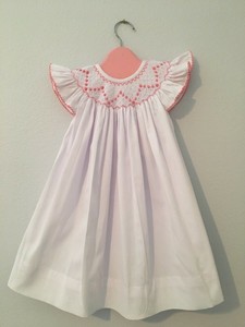 white smocked baby dress