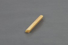 Vintage unbleached bone guitar nut, Martin style 1-3/4" width, angled, slotted