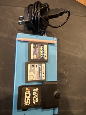 Nintendo DSi With Stylus, Charger, 2 Games And Action Replay