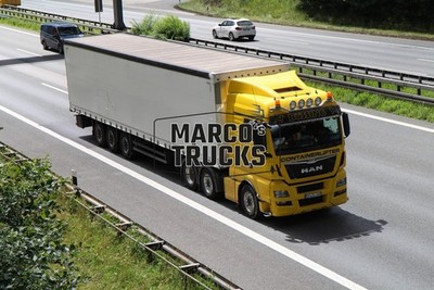LKW Foto MAN TGX Planensattelzug Frankreich gelb BUSSING CONTAINERLIFTER #h2dt