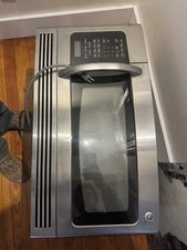 GE (General Electric) over-the-range microwave oven.