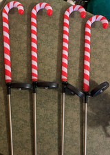 Four light-up Christmas candy cane lights with stakes