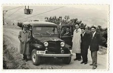 PORTRAIT OF FIVE MEN AND A JEEP ON A DIRT ROAD IN SERBIA