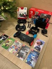 Nintendo Switch 128Gb / boxed with 6 games + extra controllers + 2 drive wheels