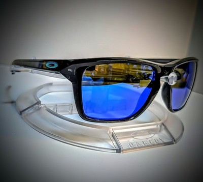 Oakley SYLAS OO9448 Polarized Sunglasses, Crystal Blank Ink w/ Blue Lenses. 