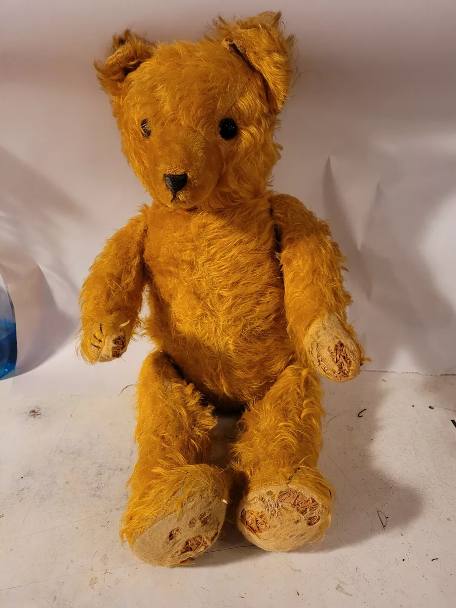 A German teddy bear 1910-1920s, with golden yellow mohair, closely