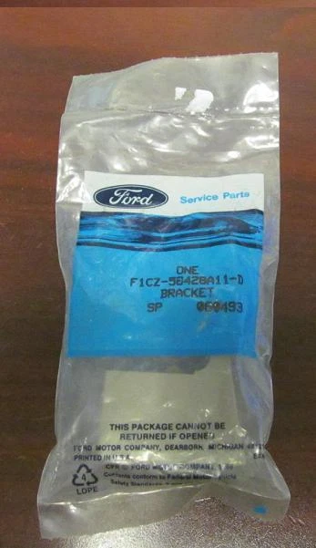 1991-93 NOS Ford Escort Tan Luggage Compartment Cover Bracket - Image 2 of 4