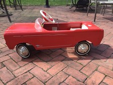 Pedal Car designed as a red 1964 Ford Mustang