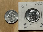 A 1956 Uncirculated & a 1964 Washington Quarters