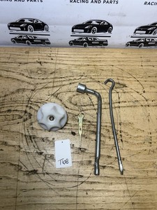 03-09 Nissan 350Z Trunk Spare Tire Hold Down Clamp OEM & Tools