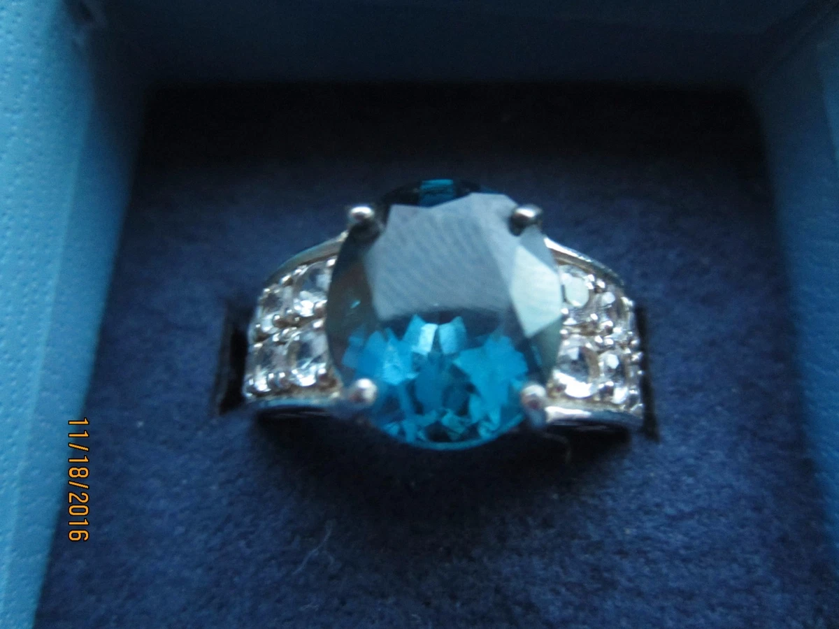 6.35 CTW BAREHIPANI TOPAZ SET IN RHODIUM PLATED 925 STERLING SILVER SZ10