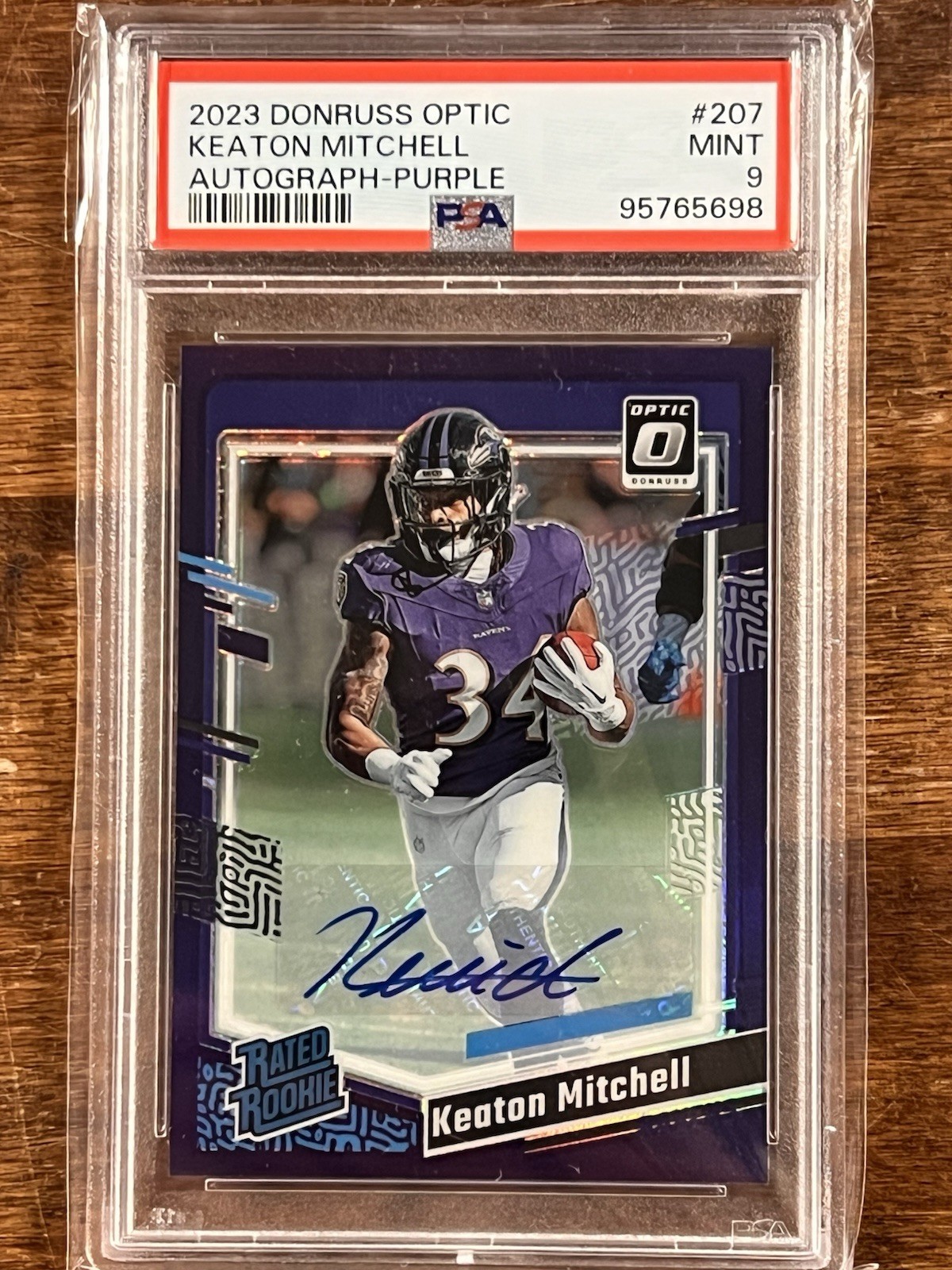 2023 Donruss Optic Rated Rookie Purple Auto #207 Keaton Mitchell /35 PSA 9