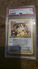 PSA 7 2000 Team Rocket 1st Edition Meowth 62/82