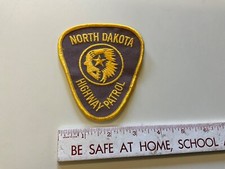 Police Sew On Patch North Dakota Highway Patrol Police