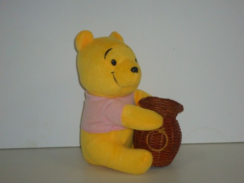 st09716 collectable pooh bear holding basket plush toys