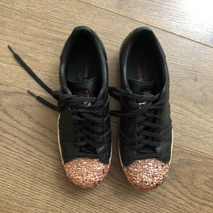 rose gold and black trainers