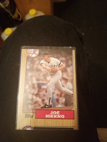 Error card Niekro #344 Topps1987 Baseball Card (New York Yankees) over cut card.
