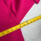 Bright pink 80s Russell Athletic hoodie XL with yellow measuring tape showing seam detail and made in USA label.