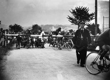 French cyclist Jean Robic climbs barrier of a level crossing after- Old Photo