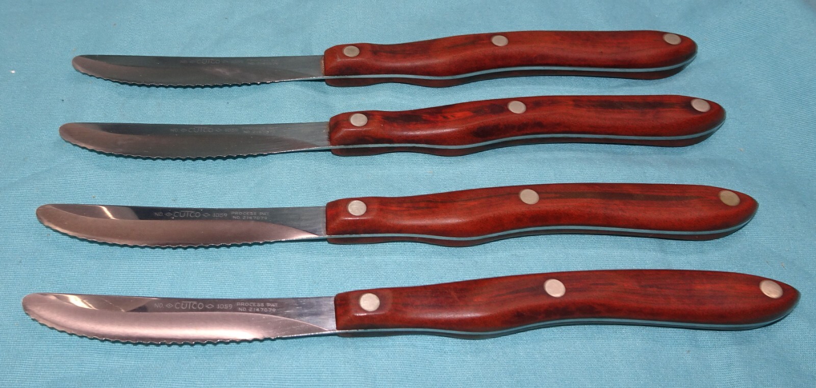 == used = Set of 4 Cutco Serrated Steak Knives 1059 Brown Handles