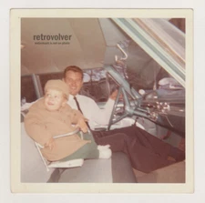 Proud Father and Son in Classic Old-Timer Car Showcasing the Elegant Interior