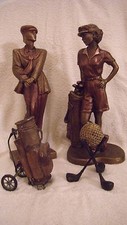 4 PIECE GOLF FIGURINE SET 2 FEMALE STATUES GOLF BAG AND 3 GOLF CLUB BALL STAND