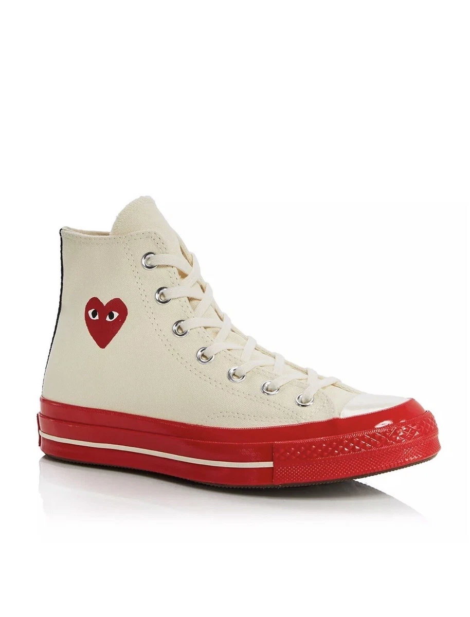 Converse with top red bottoms
