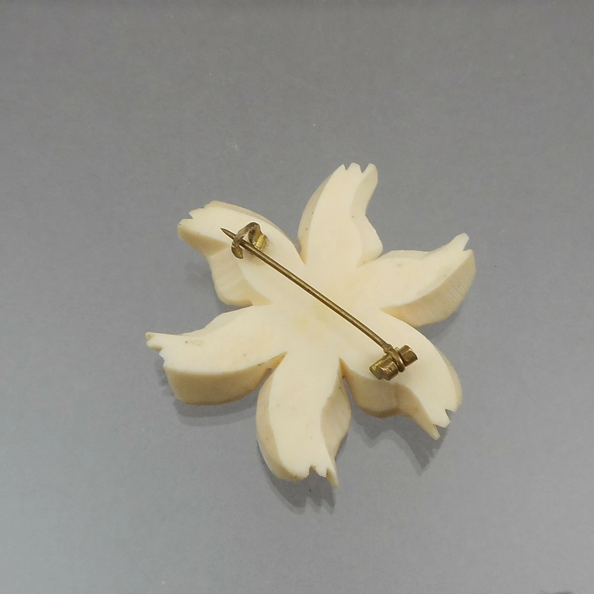 Celluloid brooch on sale