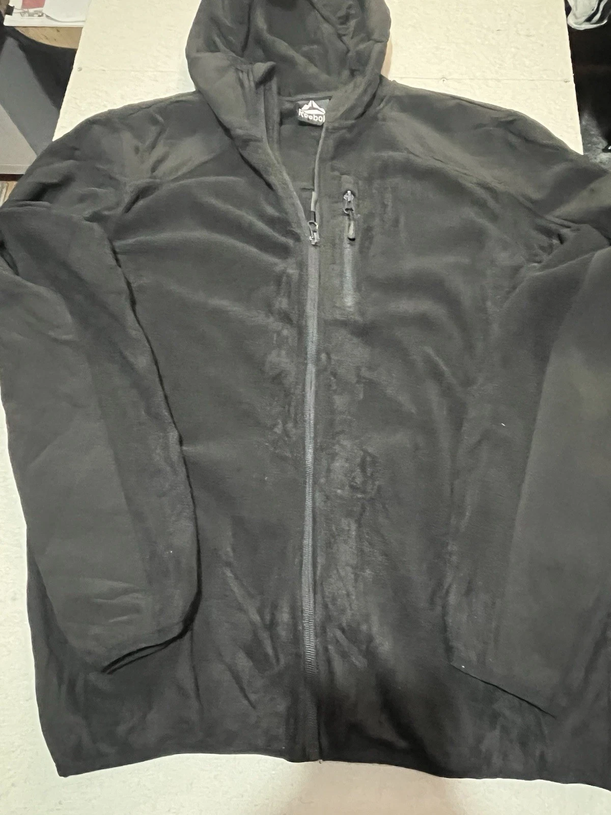 black Reebok lightweight softshell jacket with a hood. Size Large 40-42 Chest