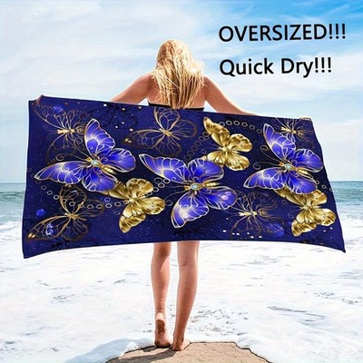 A Enormous Beach Towel Featuring a Vibrant Blue And Golden Butterfly Design, M