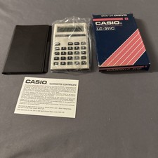 CASIO LC-311C ELECTRONIC CALCULATOR + BOX  + CASE.   (B57)
