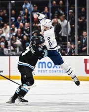 Simon Benoit Flying Punch Toronto Maple Leafs 8x10 NHL Hockey Photo
