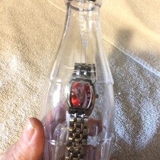 Montre femme Coca Cola cadran rouge bracelet argent