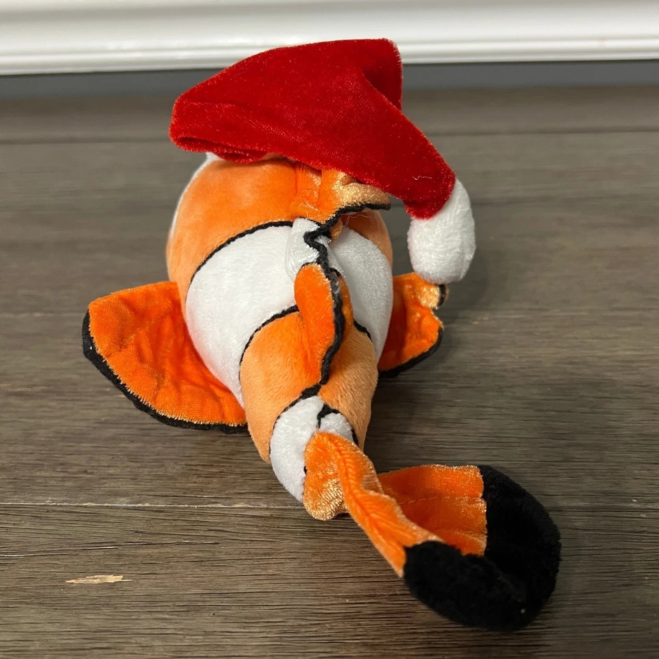 Peluche retirado Disney Store Tradiciones exclusivo Pixar Buscando a Nemo Santa Foto 3 de 4