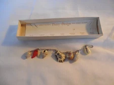 Gold tone natural sea shell charm  bracelet in original box 6"