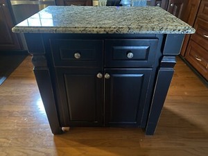 Kitchen island with granite top by Jeffery Alexander