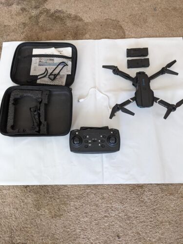 DRONE WITH CASE 2 SPARE BATTERIES PLUS ONE ON DRONE AN USB CHARGER