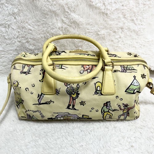 Sac Prada toile Boston 2 voies breloque motif western achats jaune