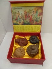 SET OF 4 POTTERY TERRACOTTA BUDDHA STATUES IN ORIGINAL SILK LINED PADDED BOX