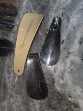 vintage metal shoehorn, likely used as an advertising piece for a Shoe Store